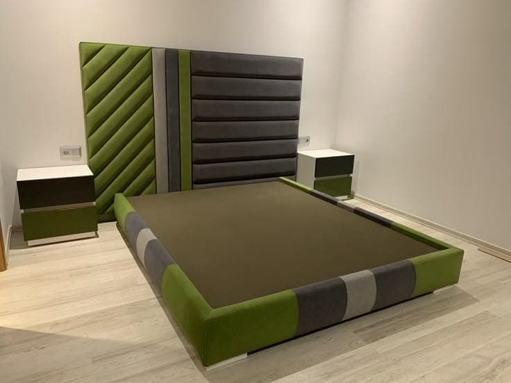 Olive and charcoal panelled bed with matching bedside nightstands