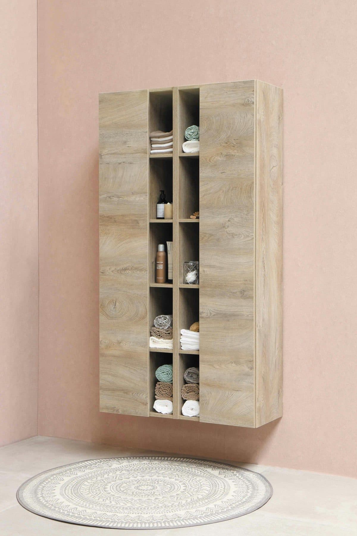 Tall wooden wardrobe and shelving unit built into a bedroom wall