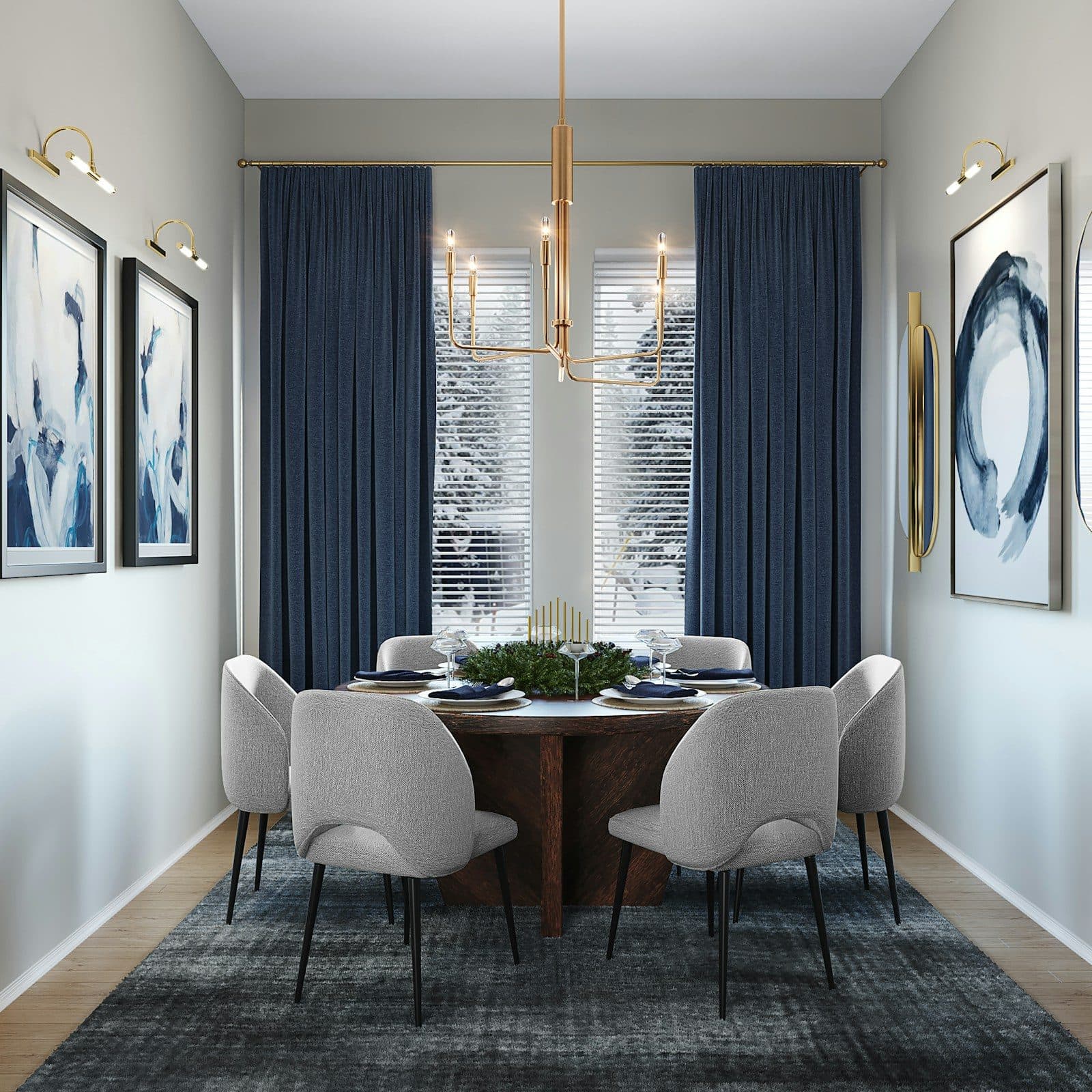 Round dining table with four upholstered chairs under a pendant light